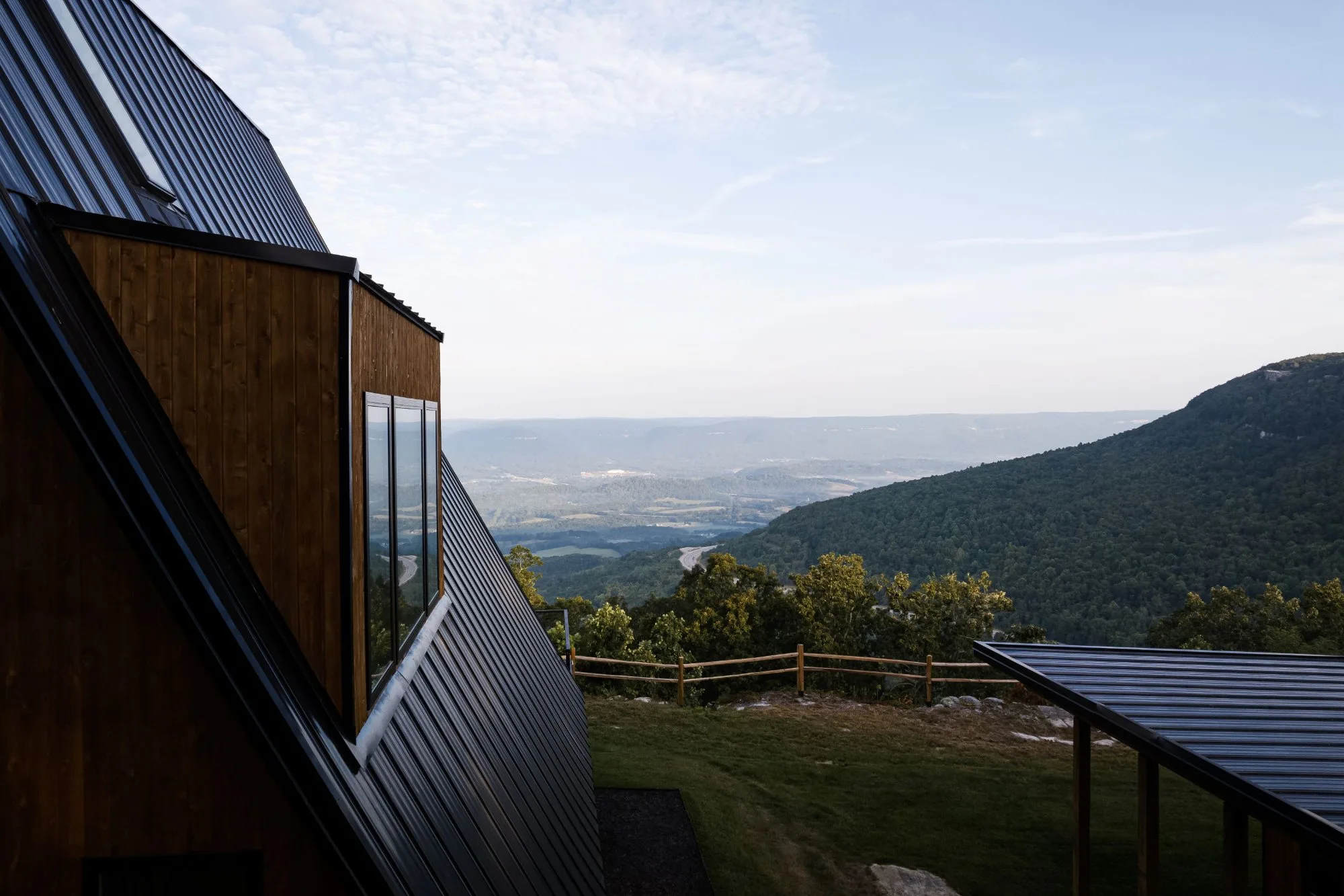 Overhead aerial view of The A-Frame cabin perched on the edge of a bluff overlooking the Sequatchie Valley, Tennessee